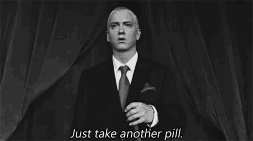 a black and white photo of a man in a suit and tie saying just take another pill