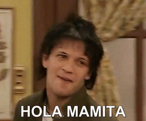 a close up of a woman 's face with the words hola mamita written on it