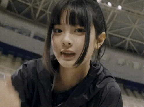 a close up of a girl with a ponytail