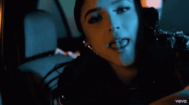 a close up of a woman 's face with the word vevo on the bottom left
