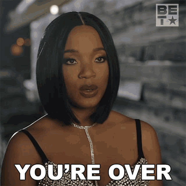 a woman says " you 're over " while wearing a bra