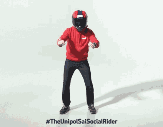 a man wearing a helmet and a red hoodie is standing on a white background