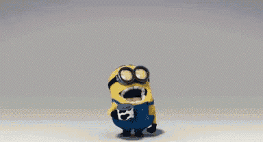 a cartoon minion wearing goggles and a yellow hat is standing on a gray surface .