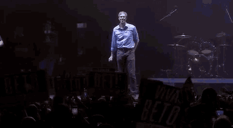a man on stage with the words i 'm so fucking proud of you guys on the bottom