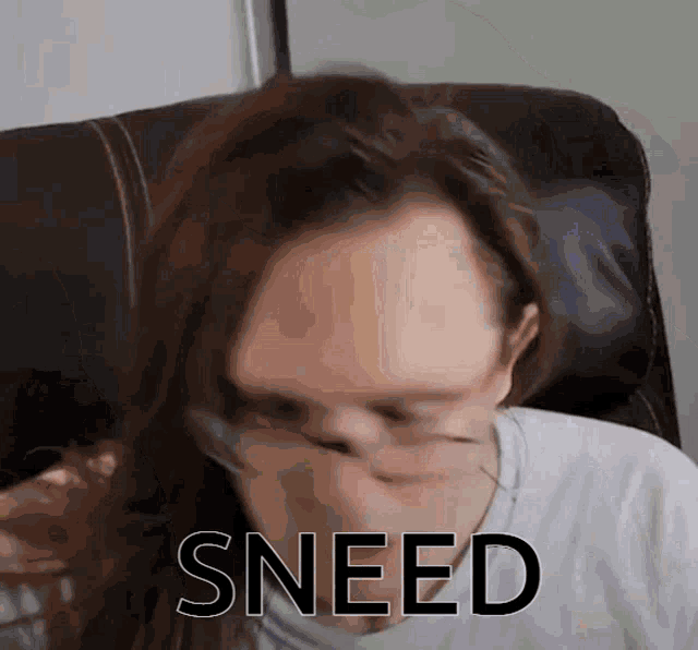 a woman covering her mouth with her hand and sneed written on the bottom
