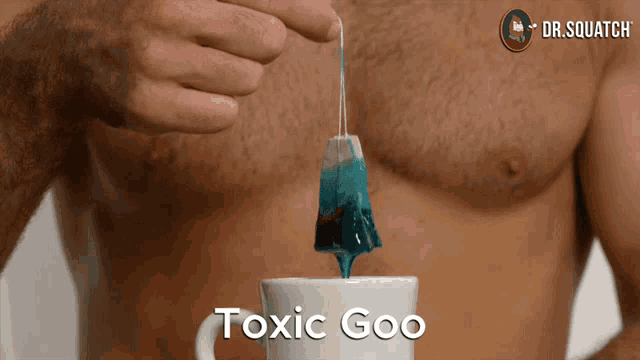 a man is pouring a tea bag into a cup that says toxic goo