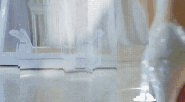 a person is standing in a room with smoke coming out of a bottle