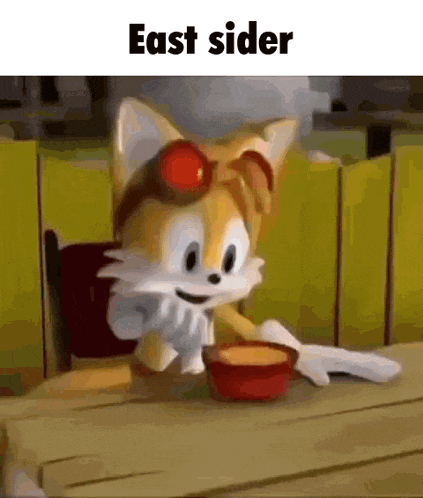tails from sonic the hedgehog is sitting at a table eating a bowl of food .