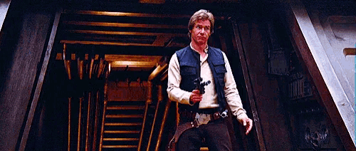 han solo from star wars is holding a gun in his hand