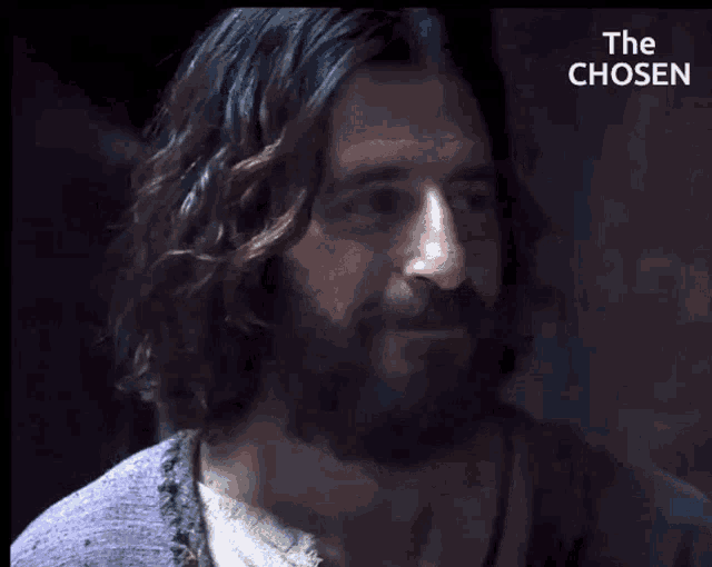 a man with long hair and a beard is asking if he feels good