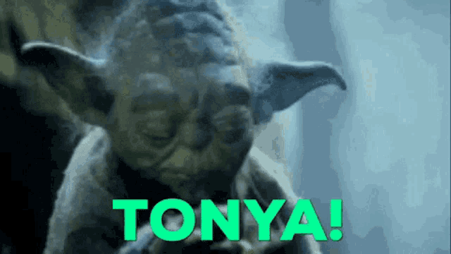 a close up of yoda with the word tonya written in green