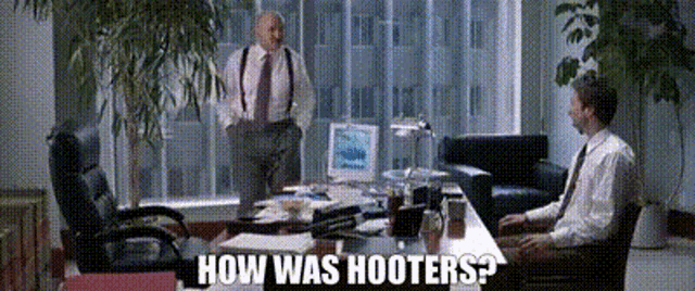 two men sitting at a desk with the words how was hooters written on the bottom
