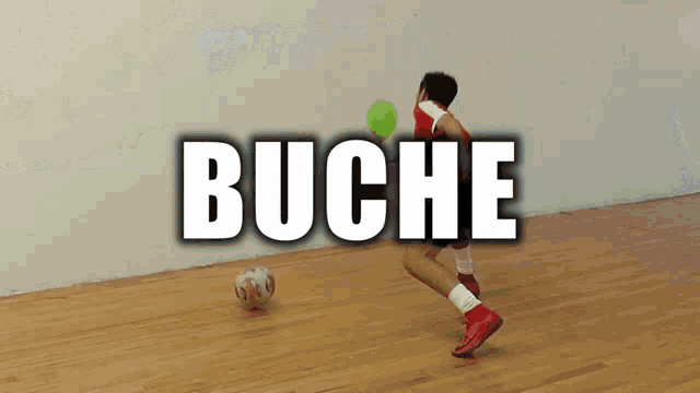 a person playing soccer in front of a wall that says buche
