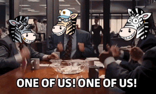 a group of people sitting around a table with zebras on their faces and one of us one of us