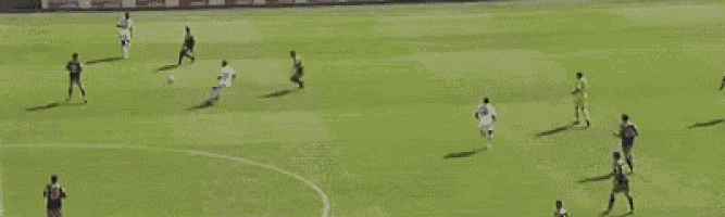 a group of people are playing soccer on a field .