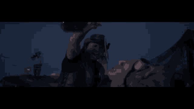 a man in a cowboy hat is pouring water into another man 's mouth and the name jason is on the bottom