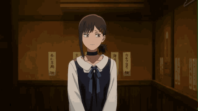 a girl with a choker around her neck stands in front of a wall with asian writing on it