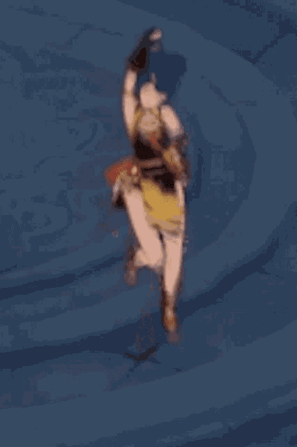 a cartoon character is jumping in the air with her arms in the air in a video game .