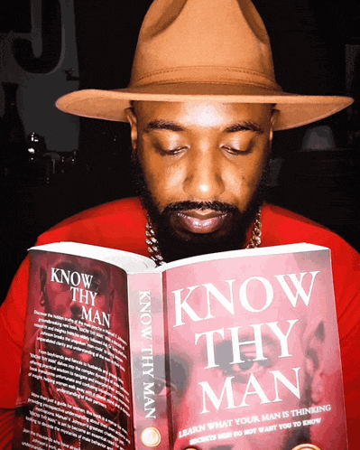 a man in a hat is reading a book called know thy man