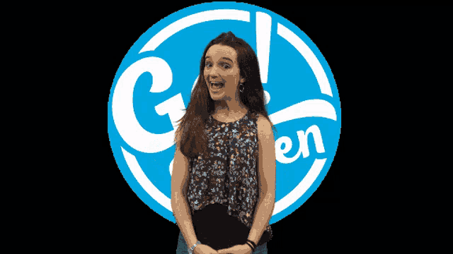 a girl is standing in front of a logo that says go