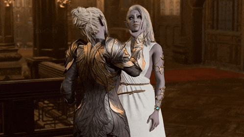 a woman in a white dress stands next to a woman in a gold armor
