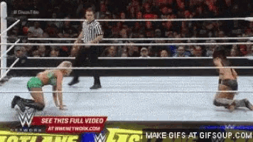 two women are wrestling in a wrestling ring with a sign that says " see this full video "