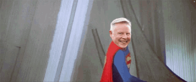 an older man is dressed in a superman costume
