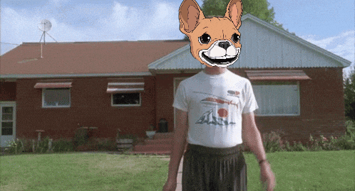 a man wearing a t-shirt with a dog on his head