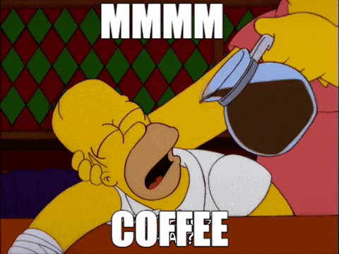 homer simpson drinking a cup of coffee with the words mmmm coffee below him