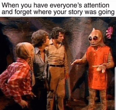 a group of people are standing next to each other in a cave .