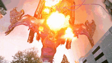 a statue of a dragon with flames coming out of it 's eyes