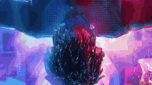 a purple and blue background with a person 's head in the center