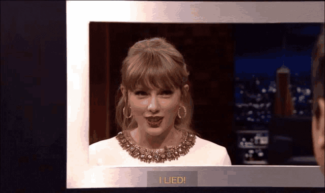 a woman is behind a screen that says " i lied "