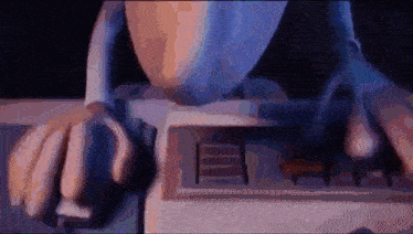 a person is typing on a keyboard with a mouse
