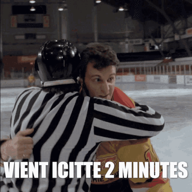 a hockey referee is hugging a player with the words vient icitte 2 minutes written below them