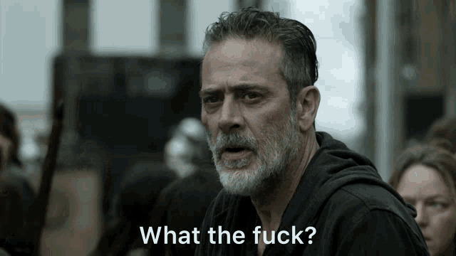 a man with a beard and a black shirt says " what the fuck "