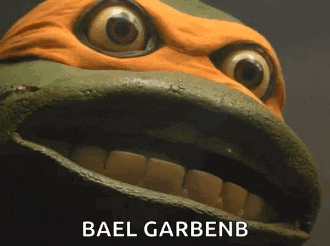 a close up of a teenage mutant ninja turtle 's face with its mouth open and the words bael garbenb .