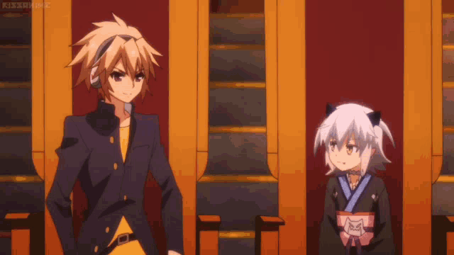 a boy and a girl are standing next to each other and the girl has a cat on her head