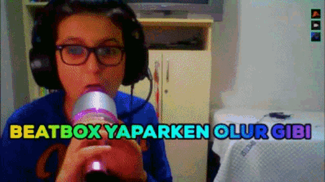 a girl wearing headphones is drinking from a can and the words beatbox yaparken olur gibi are above her