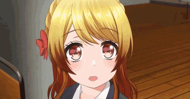 a close up of a girl 's face with yellow hair and red eyes