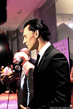 a man in a suit and tie is being interviewed by a person with a microphone that says fox