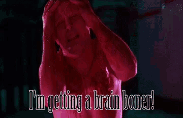a man is holding his head and the words i 'm getting a brain boner