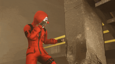 a person wearing a clown mask and a red hoodie