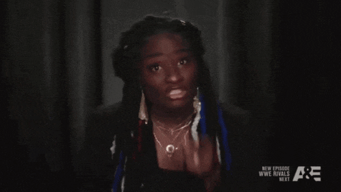 a close up of a woman 's face with the words wwe rivals next visible