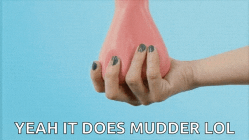 a woman holds a pink object in her hand with the words yeah it does mudder lol below it