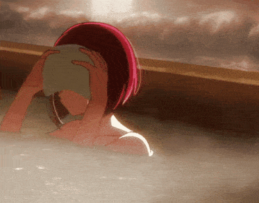 a woman with red hair is taking a bath
