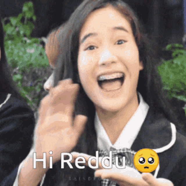 a girl with braces on her teeth is smiling with the words hi reddu below her