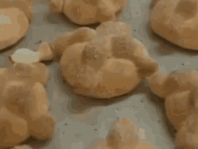 a close up of a bunch of bread on a pan