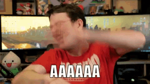 a man in a red shirt with the word aaaaa on it