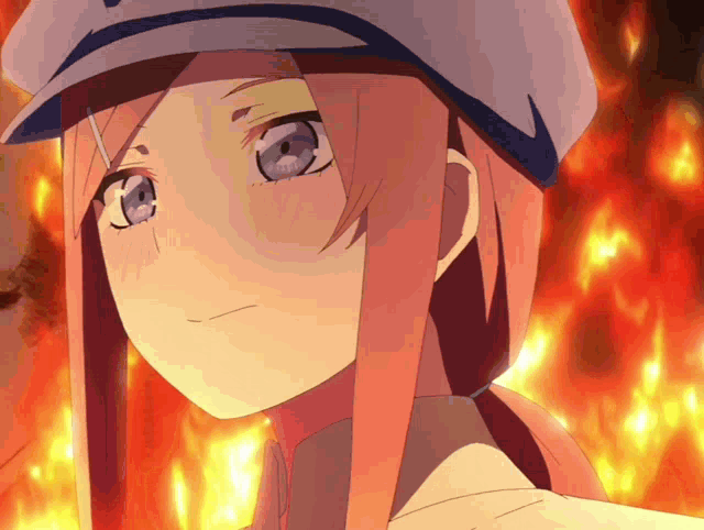 a close up of a girl 's face with a fire background